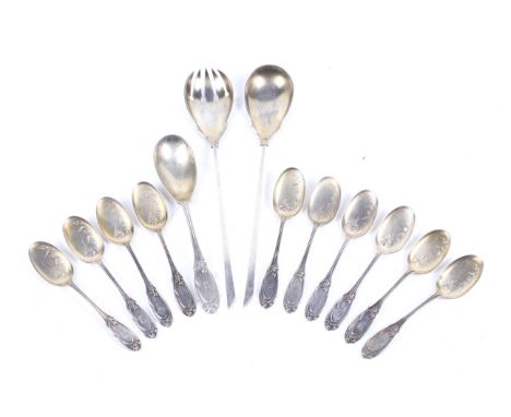 A set of German .800 standard silver ice cream spoons and a serving spoon. Each with a floral oval handle engraved with a scr