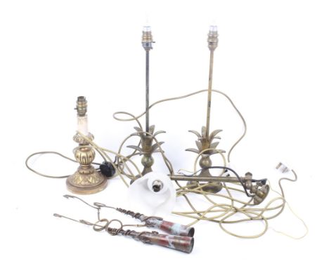 A group of assorted electric lights. Including a pair of metal table lamps, a wooden table lamp, a brass wall light, etc. Max