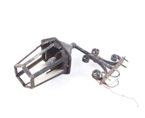 An early 20th century painted steel Arts and Crafts wall light. With some wrought ironwork and hexagonal shade, H43cm