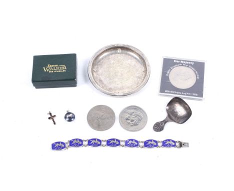 A silver caddy spoon and other items. The caddy spoon with a shaped handle embossed with anthemion, hallmarks for Sheffield 1