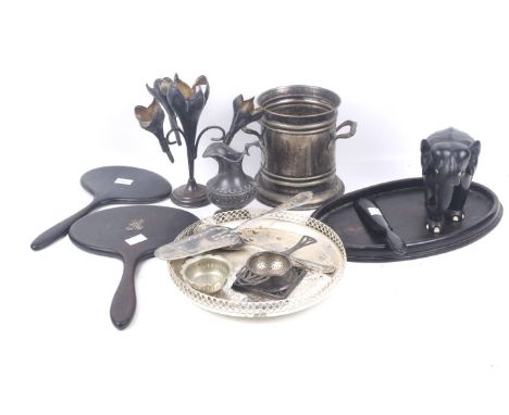 A small collection of silver plate, ebony and other items. Comprising a small round epergne with three petal-shaped vases; a 