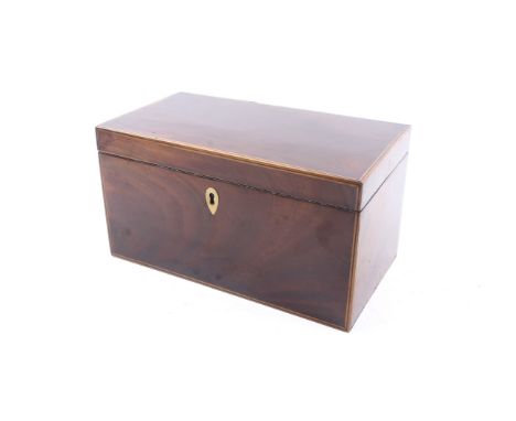 A 19th century mahogany veneered tea caddy. With stringing to the edges, containing two lidded compartments and inlaid detail