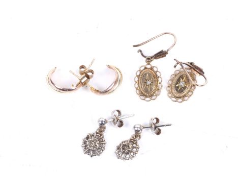 Three pairs of 9ct gold earrings. One pair featuring a single diamond in an oval mount, another with a single diamond in a pi