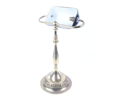 A banker's style desk lamp with brass base and dark green shade. H54cm