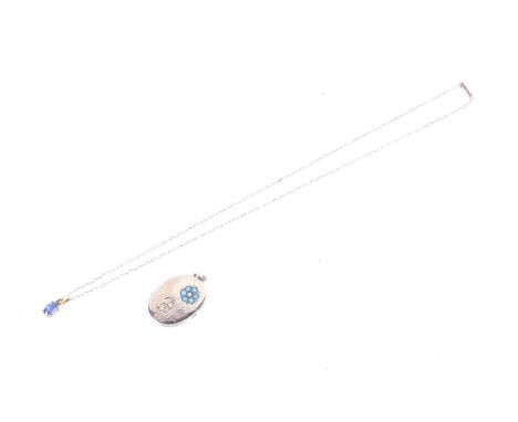 A modern oval sapphire single stone pendant and chain and an oval locket. The pendant stamped '750', this hung from a fine tr