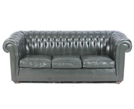 A contemporary dark green leather Chesterfield button back three-seater sofa. With steel domed head stud decoration, H74cm x 