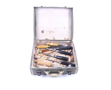 An assortment of wooden handled chisels. Including examples by Ashley Isles, contained in a vintage Regentone case