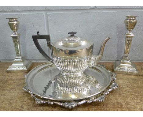 A pair of Walker &amp; Hall silver plated candlesticks, two trays and a teapot