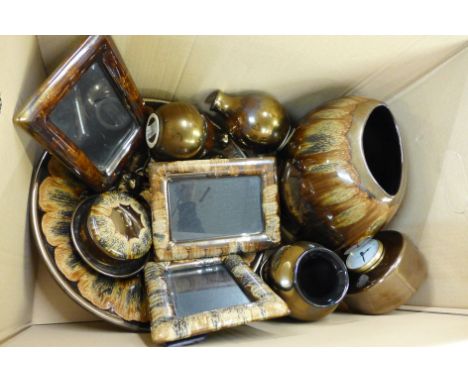 A collection of Poole Pottery, large bowl, four vases, mantel clock, two figures of cats, three photograph frames, lidded pot