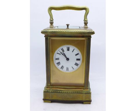 A brass repeater carriage clock, enamel dial, movement signed Paris, 14cm, two bevelled glass panels with small chips to one 