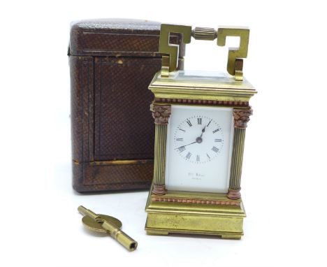 A miniature French brass carriage clock with four Corinthian columns, in brown Morocco leather case, 9cm