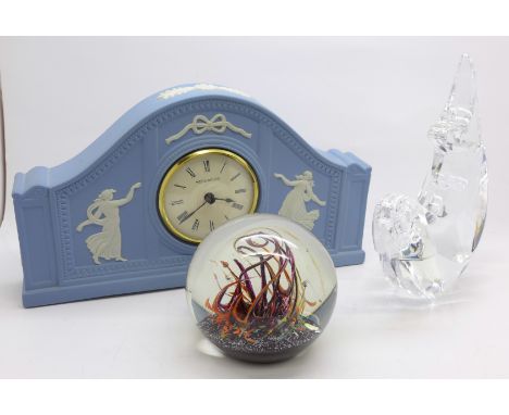 A Selkirk glass paperweight, signed to base, an Orrefors of Sweden paperweight and a Wedgwood Jasperware clock
