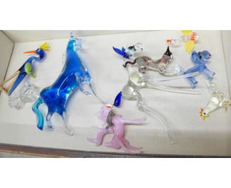 A collection of figures, three Poole figures and glass figures