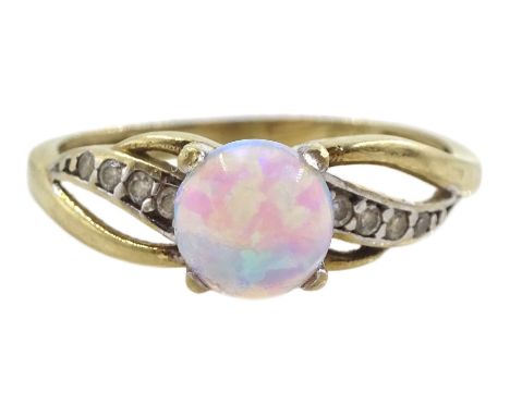 Gold opal ring with cubic zirconia shoulders, stamped 9K