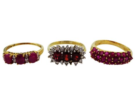 Gold three stone ruby ring, each ruby set with two diamonds between, gold garnet and cubic zirconia cluster ring and one othe