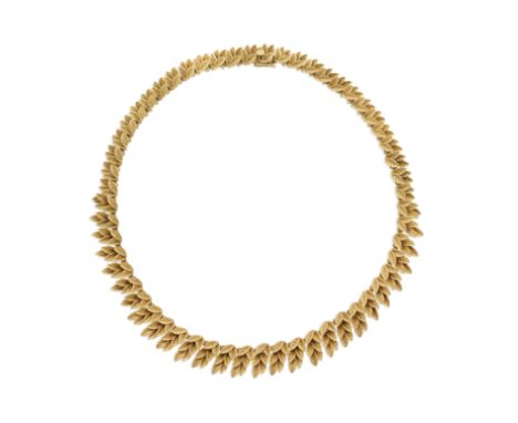 BOUCHERON: LEAF NECKLACE, CIRCA 1960Designed as a series of graduated leaves,  signed Boucheron, French assay marks, length 3