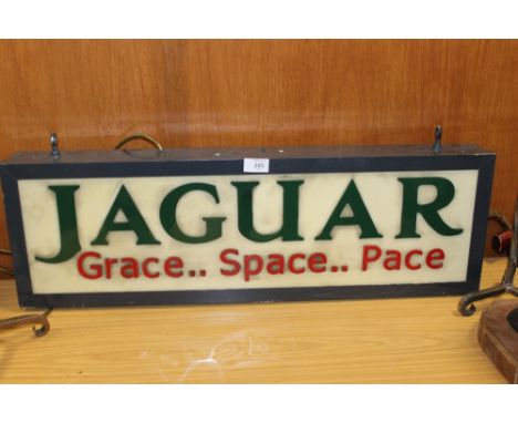 A VINTAGE ILLUMINATING JAGUAR 'GRACE...SPACE...PACE' ADVERTISING SIGN