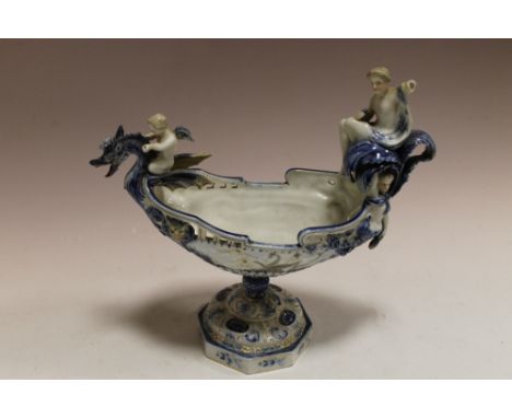 A CONTINENTAL CERAMIC NAUTILUS URN WITH CHERUBS  A/F