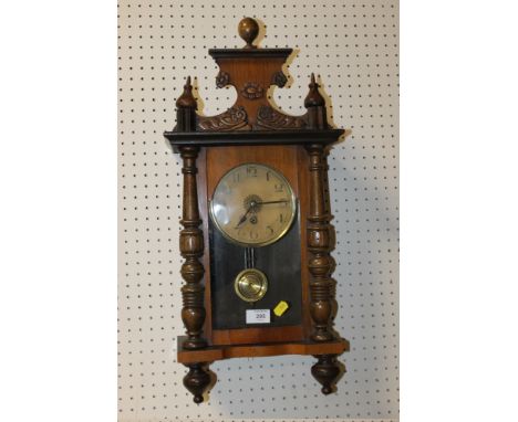 A VINTAGE CARVED WALL CLOCK