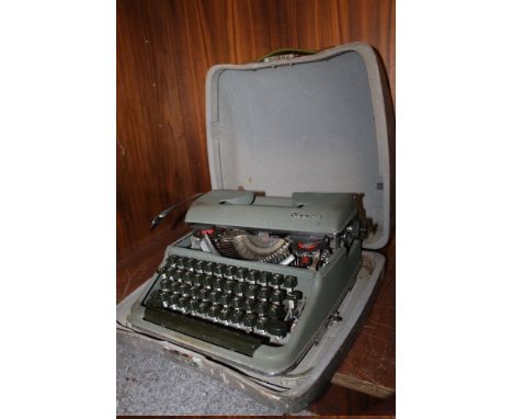 A VINTAGE CASED OLYMPIA TYPEWRITER
