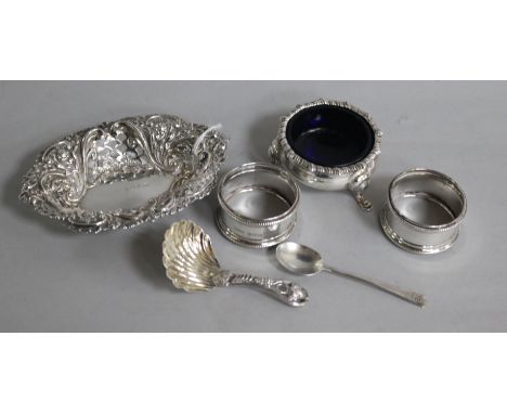 An Edwardian silver bon bon dish, a caddy spoon, two napkin rings and an Edwardian silver salt and spoon