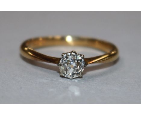 A 22ct gold and solitaire diamond ring, size R.