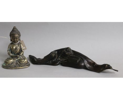 A Chinese bronze scroll weight and a bronze figure of a Buddha
