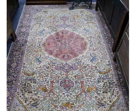 A Persian 'Tree of life' ivory ground carpet W.275 x 180cm