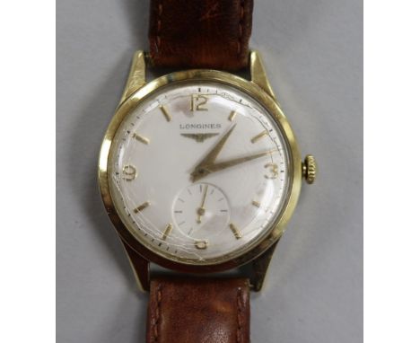 A gentleman's 14ct gold Longines manual wind wrist watch.