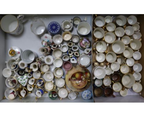 A large collection of miniature porcelain mugs and other ceramics including Royal Worcester, Royal Crown Derby, Royal Doulton