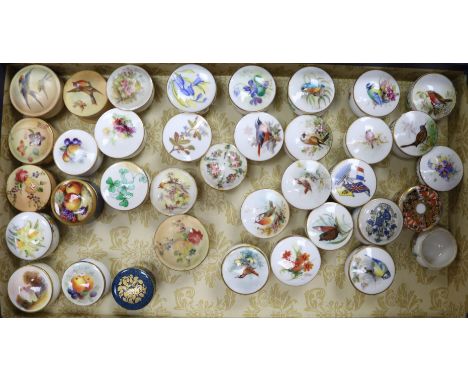 A collection of Royal Worcester and other rouge pots and covers, three fruit painted