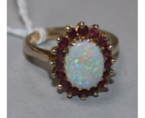 A 9ct gold, ruby and white opal cluster ring, size O.