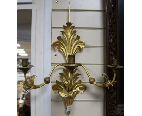 A pair of gilt metal three light wall sconces