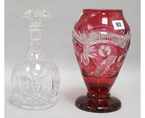 A ruby cut glass vase and a decanter