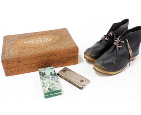 A pair of early 20thC leather clogs, a Hohner Echo Harp harmonica, and an Anglo Indian wooden and ivory inlaid early 20thC bo