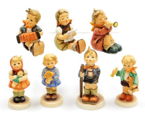 A group of seven small Goebel Hummel figures, comprising girl with trumpet, girl with sheet music, Little Hiker, girl with do