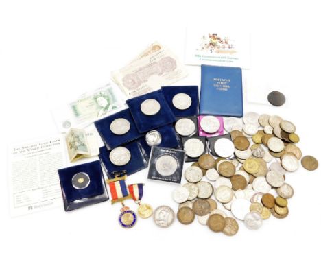 A group of chiefly nickel silver coins, some bank notes to include purple and red ten shilling notes, pound notes, decimal co