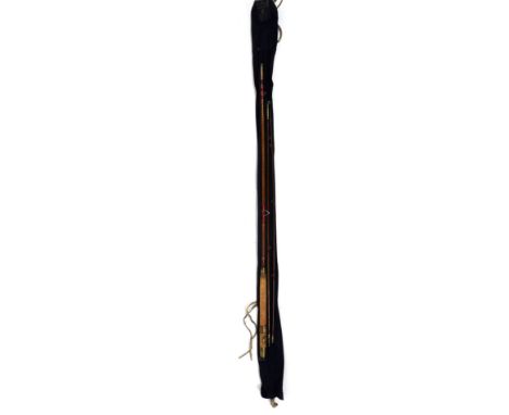 A Hardy Bros vintage three piece greenheart fly rod, numbered 37252, with brass fittings and later replacement rings and refu