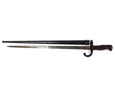 A late 19thC St Etienne bayonet, engraved to the blade Mre D'Armes de Chat, June 1876, number 10505, with scabbard.  