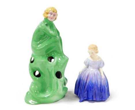 A 1920/30's Wilkinson pottery centrepiece modelled in the form of a scantily clad seated lady, in green, and a Royal Doulton 