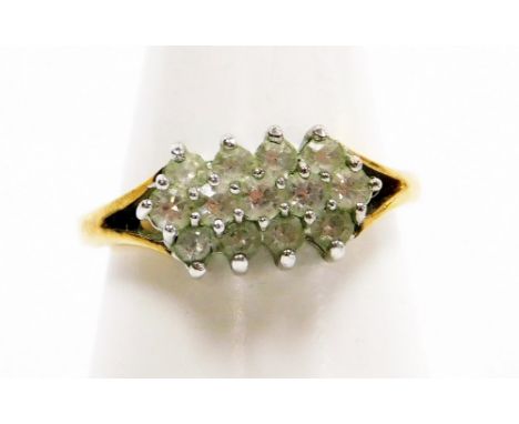 A cluster ring, set with layered cz stones, on yellow metal band, unmarked, ring size P½, 2.8g all in.  