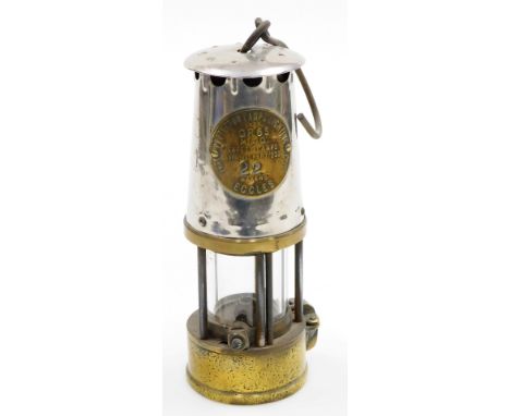 A Protector Lamp Lighting Co Ltd miner's lamp, stamped number 22, in steel and brass, 23cm high.  