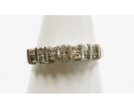 A diamond half hoop eternity ring, set with arrangement of six round brilliant cut diamonds and eight baguette cut diamonds, 
