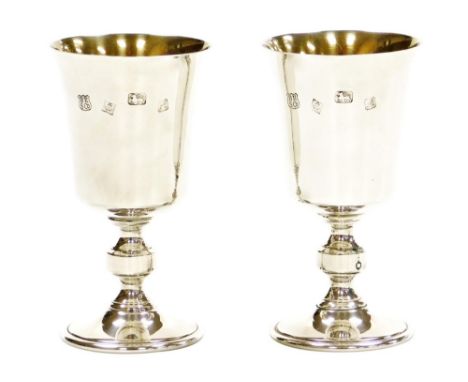 A pair of Elizabeth II silver goblets, with a plain bowl and knopped stem, Birmingham 1975, by Barker Ellis Silver Co, 9¾oz, 