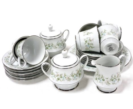 A Noritake porcelain part tea service decorated in the Savannah pattern, comprising bread plate, cream jug, a pair of graduat