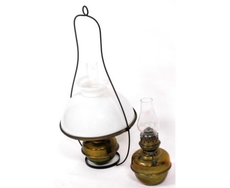 A Young's brass hanging oil lamp, with glass chimney and white glass shade, 68cm high, together with a Veritas brass oil lamp