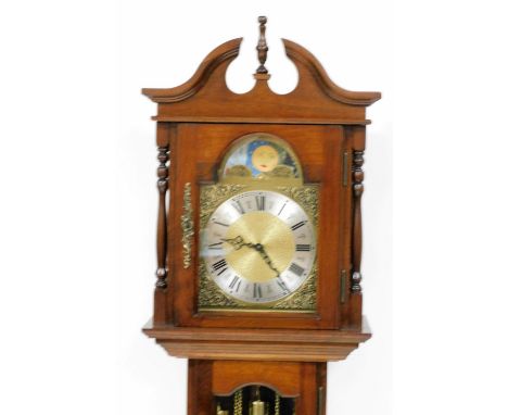 An Emperor Clock Company grandmother clock, the arched brass dial with moon phase, silvered chapter ring bearing Roman numera