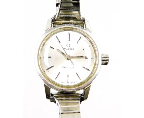 An Omega lady's stainless steel and plated wristwatch, the silver coloured dial with batons, stamped Omega Geneva, Swiss made