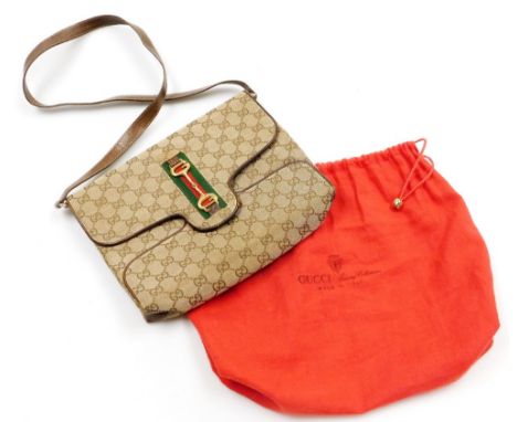 A vintage Gucci Ophidia shoulder bag, with GG monogrammed fabric, brown leather trim and handles, and GG horsebit gold colour
