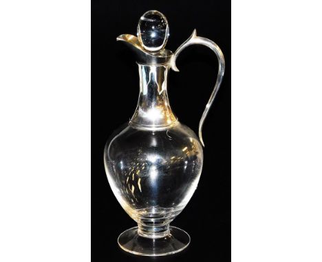 A late 20thC glass claret jug, of baluster form, with a silver collar and handle, J A Campbell, London 1997, 32cm high. 